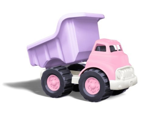 Caminhão de brinquedo rosa no chão de asfalto. carro fora de